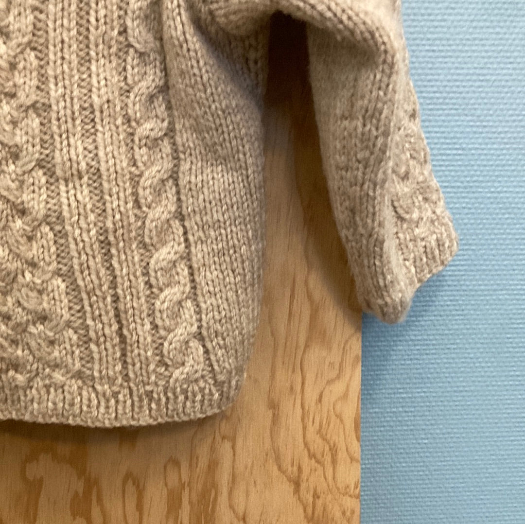 Pull torsadé sable