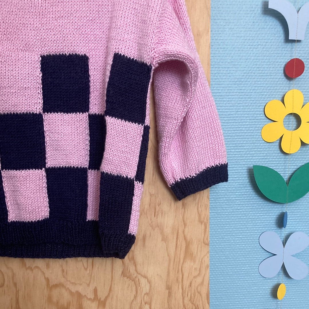 Pull de Joëlle Damier rose et bleu marine